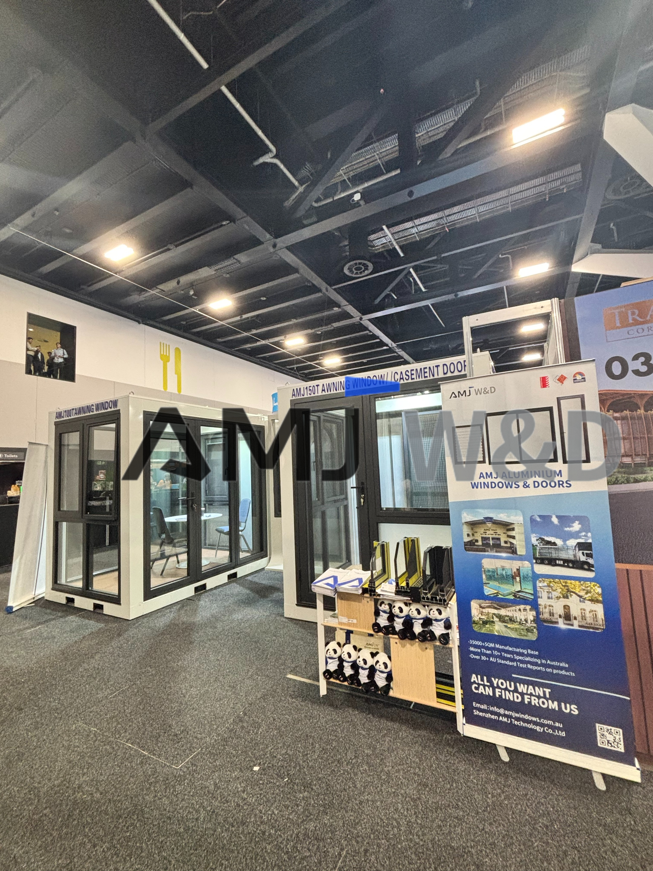 Visitors viewing AMJ aluminum windows and doors