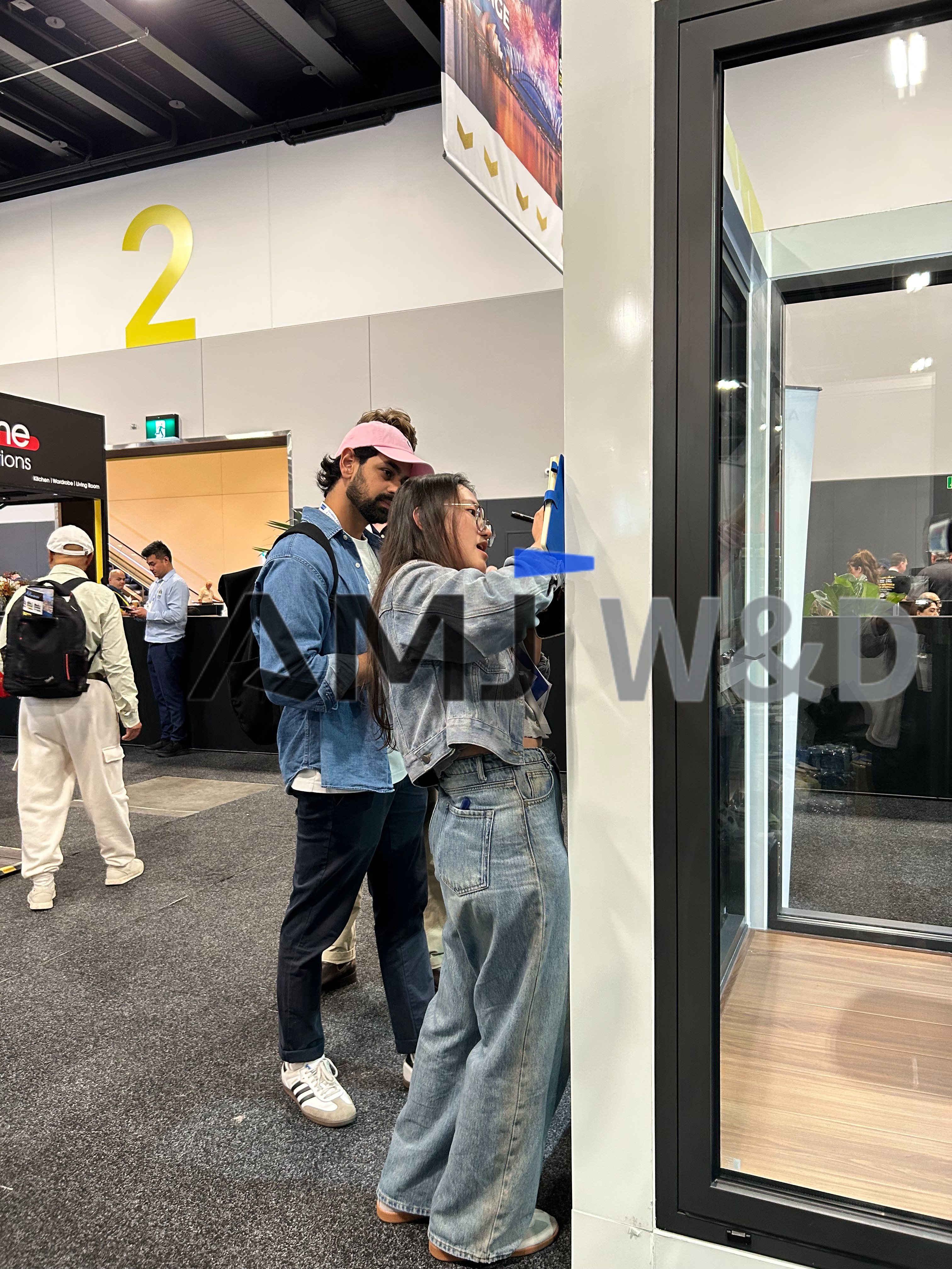 Customers discussing aluminum window and door project details