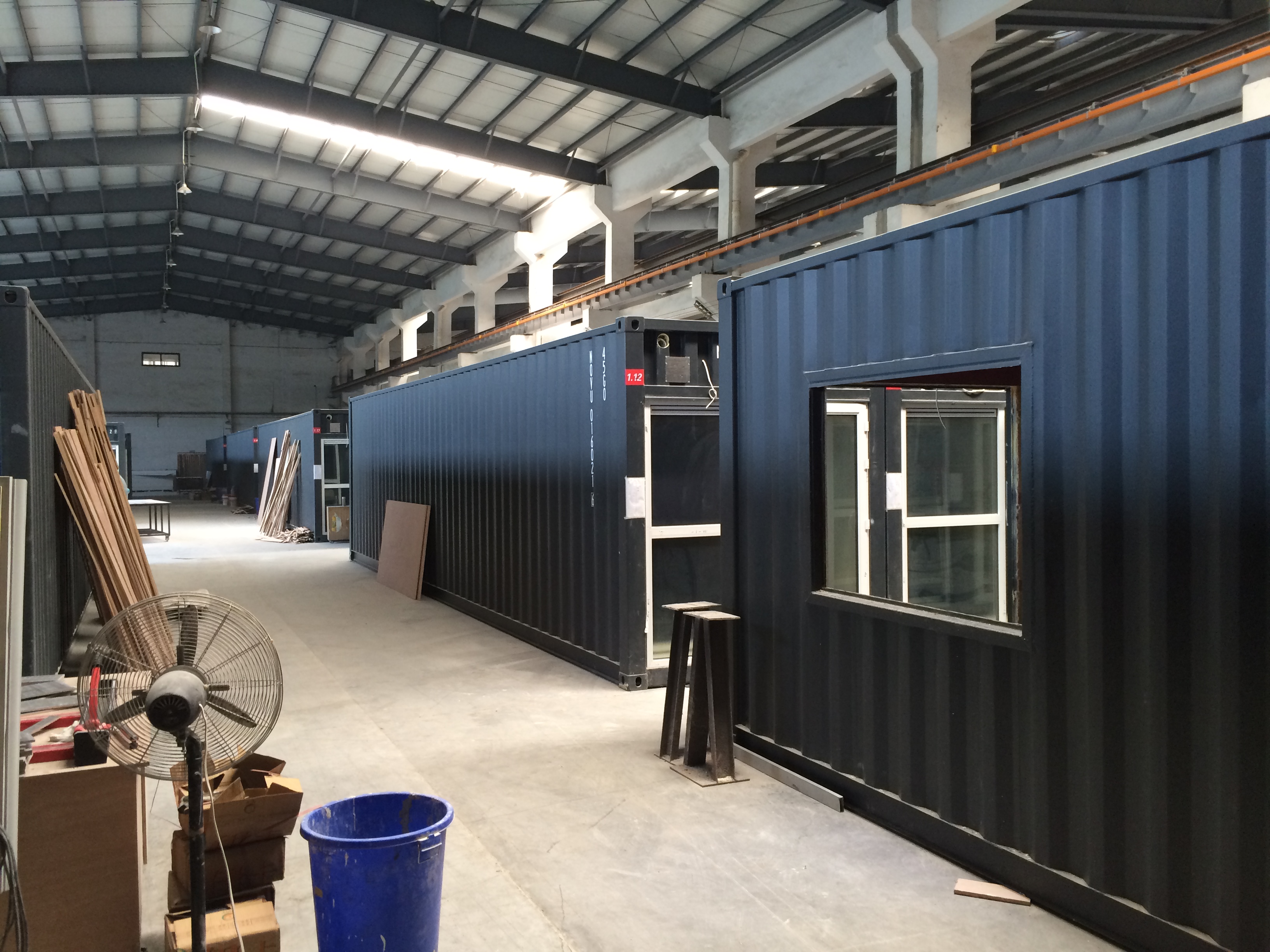 Container-style modular units with AMJ aluminum windows and doors in factory