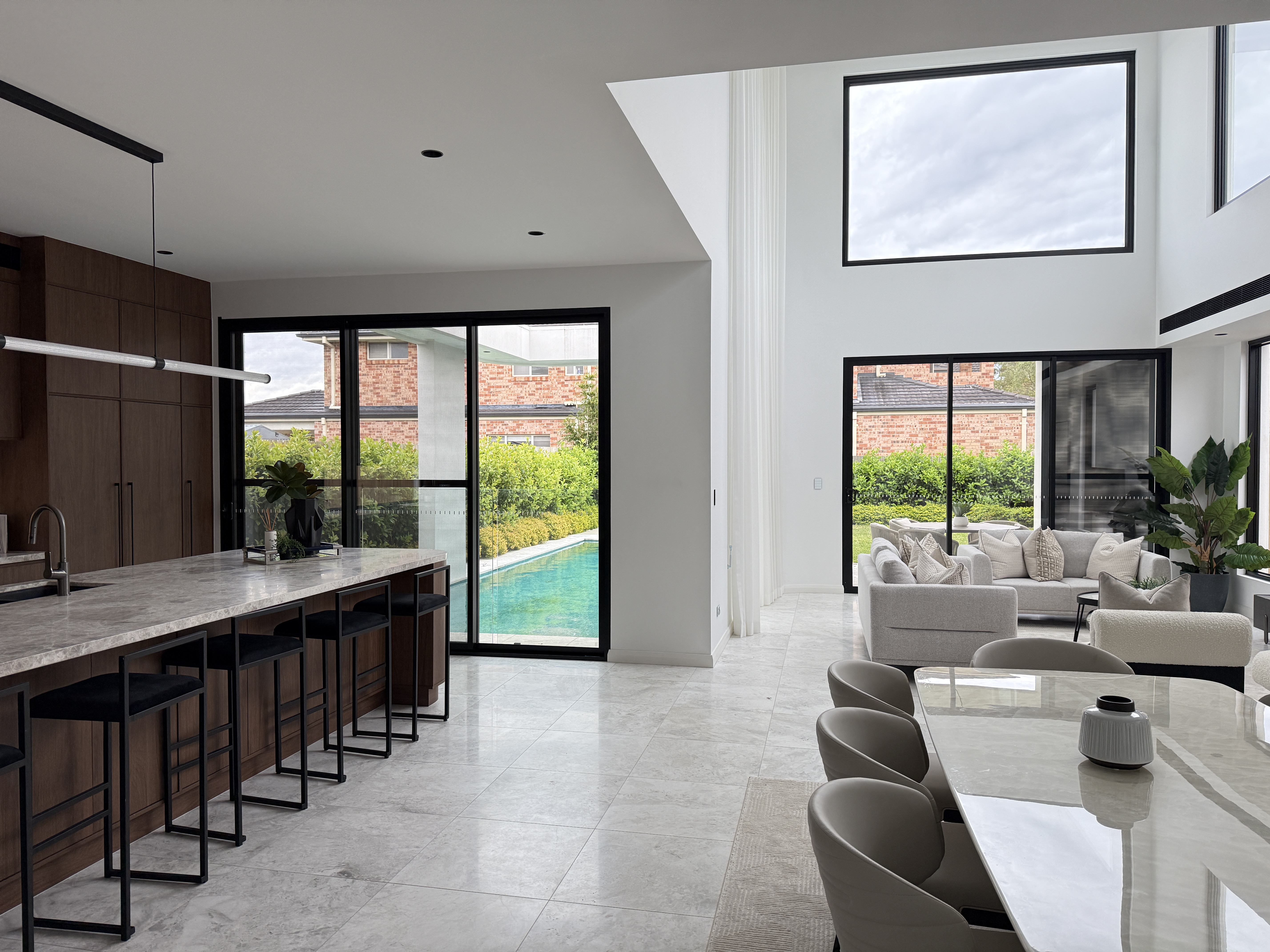 Large aluminum living room windows in a modern residential home