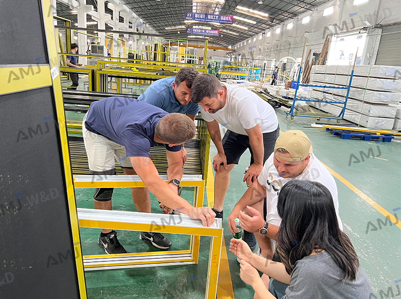 Builder and aluminum window supplier reviewing project quotation details