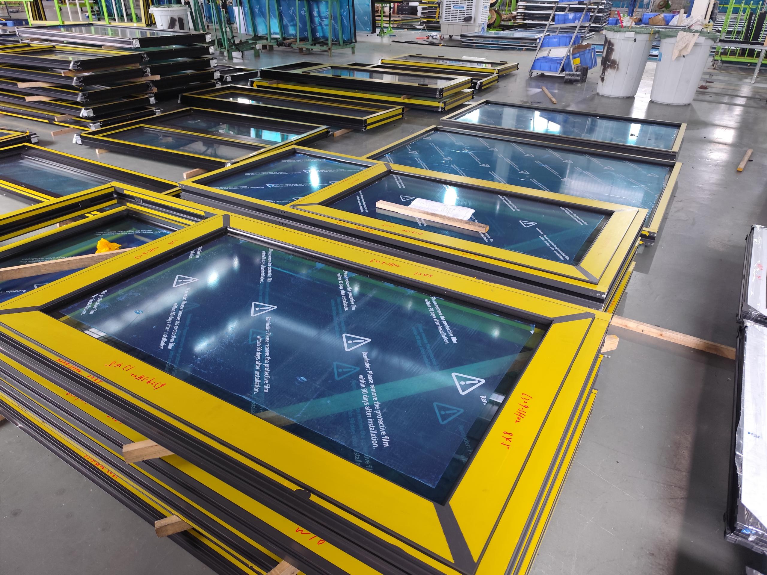 Builder reviewing aluminum window performance requirements