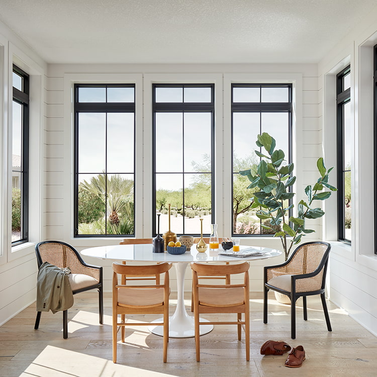 Operable aluminum transom window above an exterior door for daylight and high-level ventilation
